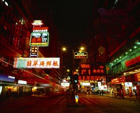 HONG KONG, Kowloon Peninsula, Kowloon, "Nathan Road at night with colourful neon lights, traffic