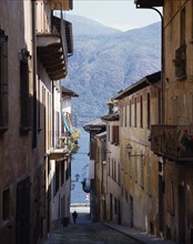 ITALY, Piedmont, Lake Maggiore   , Cannobio. Steep cobbled street leading down to lake