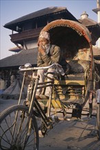 NEPAL, Kathmandu, Durbar Square Rickshaw and driver