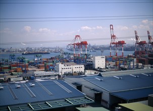 JAPAN, Osaka, Osaka Bay, "Aerial view over the docks with warehouses, containers, cranes and ships.