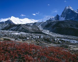 NEPAL, Sagarmatha National Park, Himalayan mountain peaks with glacial debris in the foreground