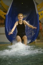 10018114 CHILDREN Leisure Swimming Girl sliding down water slide
