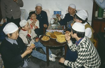 CHINA, Gansu Province, Lanzhou, Muslim family celebrating the end of Ramadan.
