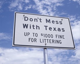 USA, Texas, General, Sign reading Don't Mess with Texas with light cloud and blue sky beyond