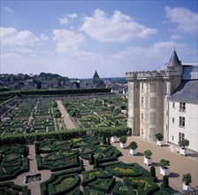 FRANCE, Indre Loire, Villandry, "View looking down across gardens and corner of chateau, blue and