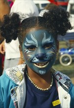 CHILDREN, Play, Face Painting, Girl with face painted with cat design.