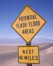 USA, California, Death Valley, Yellow Potential Flash Flood Areas warning roadsign