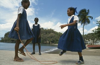 WEST INDIES, St Lucia, Anse La Raye, Schoolgirls with skipping rope