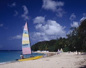 BARBADOS,  West Coast  , "Sandy Lane beach, yellow hobie cat, people and yachts in distance "