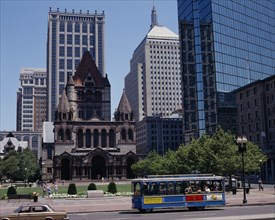 USA, Massachusetts, Boston, Copley Square and Trinity Church with a blue tram in the foreground