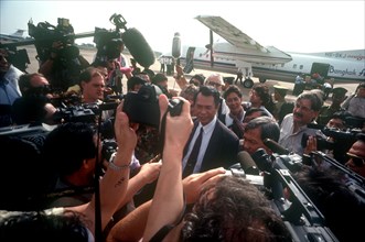 CAMBODIA, Politics, Press surrounding the arrival of Son Sen on airport runway.