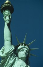 USA, New York State, New York, Cropped shot of Statue of Liberty detailing head and raised arm.