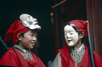 JAPAN, Honshu, Nikko, The Autumn Festival with two young boys dressed in red and wearing white