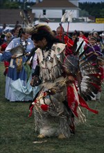 CANADA, Tribal People, Ojibway Tribe, Man dressed in full regalia taking part in Pow Wow
