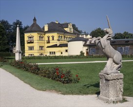 AUSTRIA, Salzburg Province, Salzburg, "Hellbrunn Palace, yellow building seen from across gardens
