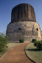 INDIA, Uttar Pradesh, Sarnath, "Dhamekh Stupa, elaborately carved brickwork with path leading up to
