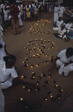 SRI LANKA, Anuradhapura, Lighting lamps during Wessac.