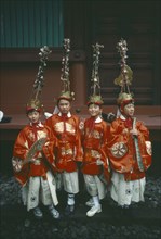 JAPAN, Honshu, Nikko, Four young boys in costume with elaborate head-dresses at the Autumn Festival