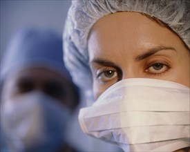 MEDICAL, Surgery, Nurse, Portrait of female member of surgical team wearing mask and cap