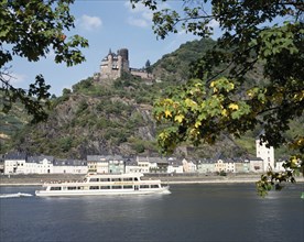 GERMANY, Rhineland, St.Goarshausen, View from St Goar on the River Rhine with a cruise boat passing
