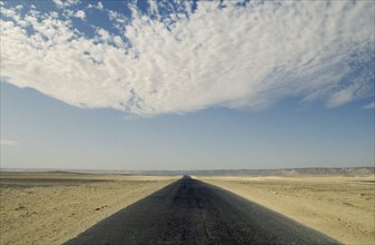 EGYPT, Western Desert, near Farafra Oasis, Tarmac road through desert