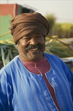 EGYPT, Edfu, Smiling man wearing brown turban