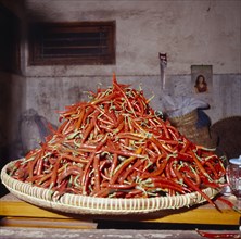 INDONESIA, Java, Yogyakarta, Red chilli peppers on rattan tray