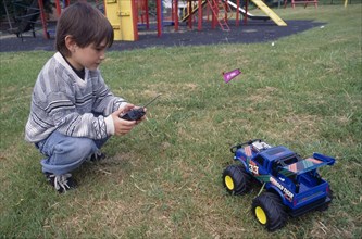 CHILDREN, Playing, Outdoor,  Boy with remote controlled truck.