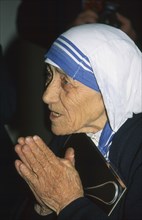INDIA, West Bengal, Calcutta, Profile of Mother Teresa praying