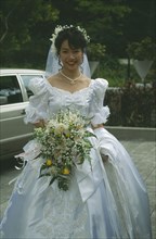 HONG KONG, Central, Hong Kong Park, Bride at registry office dressed in traditional western style
