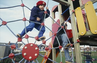 CHILDREN, Playing , Outdoor, Boy on climbing frame.