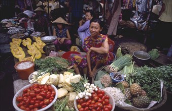 VIETNAM, South Central, Khanh Hoa Province, Nha Trang. Vegetable market vendor sitting behind