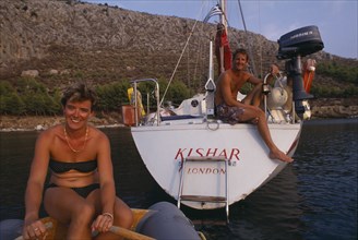 10045188 LEISURE Sailing Yachting Man and woman yachting couple in Greece