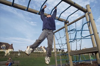 CHILDREN, Playing , Outdoor,  Boy on climbing frame.