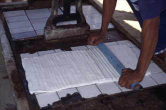 THAILAND, Phang Nga, Preparing soaked latex rubber for rolling out