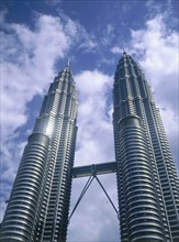 MALAYSIA, Mainland, Kuala Lumpur, Looking up towards The Petronas Towers with a lightly clouded sky