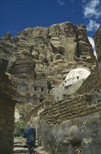 YEMEN, Thula, "Houses in hills, one white domed. Two women walking up steps"