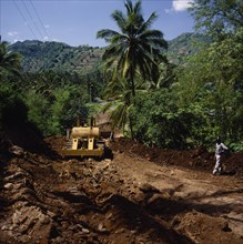 INDONESIA, Lombok, Senggigi, "Bansal road repairing after heavy rain using Caterpillar bulldozer,