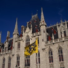BELGIUM, West Flanders, Bruges, "Main Square, Markt, Post Office building & flags "