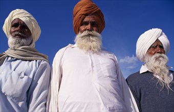 INDIA, Punjab , Amritsar, "Three elderly Sikh men, head and shoulders portrait from low angle