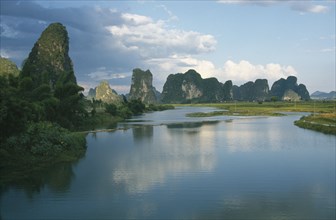 CHINA, Guangxi, Guilin, Limestone peaks seen from the River Li.