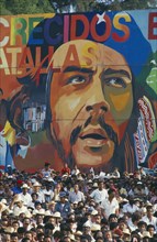 CUBA, Santiago De Cuba, Santiago, Crowd in front of  giant Che Guevara painting at 35th Anniversary
