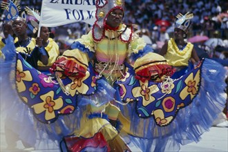 WEST INDIES, Barbados, Crop Over, Man in multicoloured costume at traditional harvest festival to