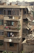 CHINA, Shaanxi, Xian, Housing block with potted plants and drying clothes on the balconies.