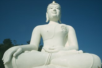 THAILAND, Chiang Mai Province, Tha Ton , Large white seated Buddha Statue