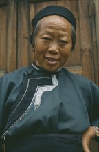 CHINA, Guizhou, Anshun , Naxi lady in traditional clothes