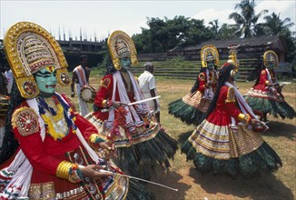 INDIA, Kerala , Kathkali Dancers, Festival dancers wearing full costumes and masks.