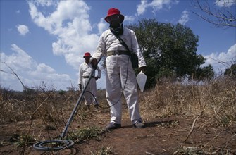 MOZAMBIQUE, Dombe, People, Mine Clearance Team at work in fields.