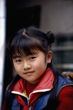 CHINA, Leshan, Portrait of a young girl
