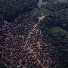 INDONESIA, South, Sumatra, "Aerial view of village,central mosque,wetlands & secondary jungle.